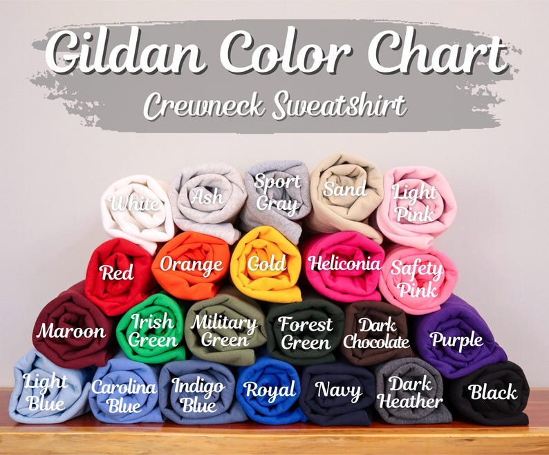 May include: Gildan Color Chart for Crewneck Sweatshirts. The chart shows a variety of colors, including maroon, light blue, Carolina blue, indigo blue, royal blue, navy, dark heather, black, purple, dark chocolate, forest green, military green, Irish green, orange, red, gold, heliconia, safety pink, light pink, sand, sport gray, ash, and white.