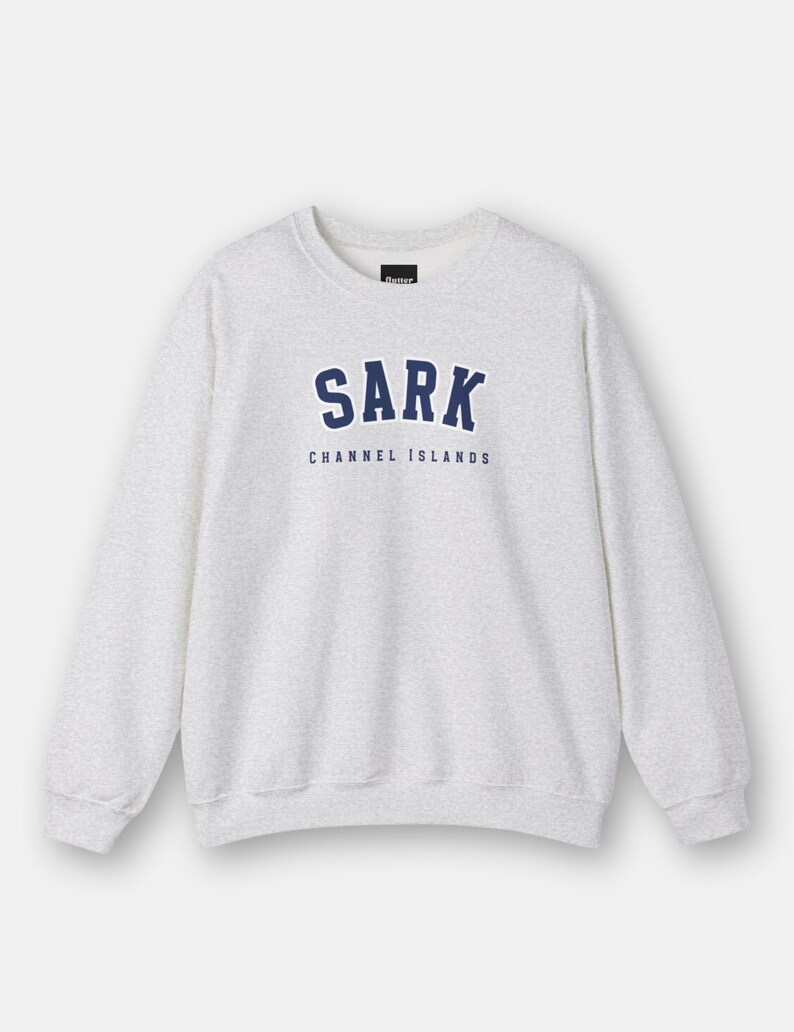 May include: A heather grey sweatshirt with a navy blue graphic print that says "SARK CHANNEL ISLANDS".