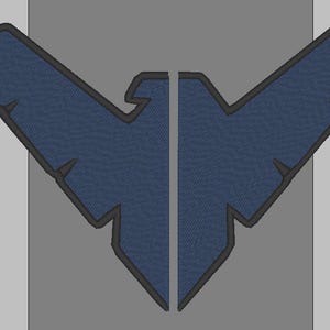 May include: A dark blue embroidered patch featuring a stylized bird emblem split into two symmetrical halves. The design has a sharp, angular shape with a black border outlining the wings and body, creating a distinct graphic silhouette.