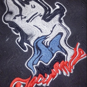 May include: Embroidered patch featuring a white cartoon figure wearing a blue hat and the word "Papa Smurf" in red lettering.