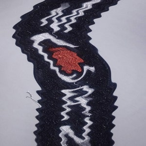 May include: Black and white embroidered patch with a red heart and the word "LOVE" in white lettering.