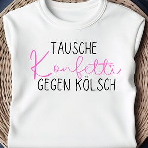 Könnte beinhalten: Weißes T-Shirt mit dem Text "Tausche Konfetti gegen Kölsch" in schwarzer und rosa Schrift.