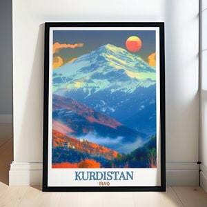May include: A framed poster featuring a colourful illustration of a mountain range with a large red sun in the sky. The text "KURDISTAN IRAQ" is printed at the bottom of the poster.