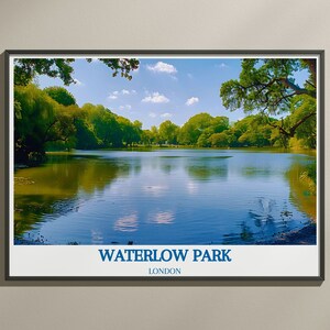 May include: A framed photograph of a lake in a park with green trees and a blue sky. The text "WATERLOW PARK LONDON" is printed below the image.