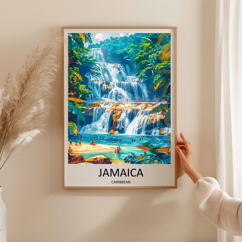 May include: A framed art print featuring a vibrant illustration of a cascading waterfall in Jamaica. Lush green foliage surrounds the falls, with people swimming in the turquoise water below. The word "JAMAICA" is printed at the bottom.