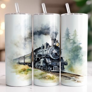 May include: Three stainless steel tumblers featuring a watercolour design of a steam engine train travelling through a forest. The train is black and grey with white smoke. The forest is green and brown with a light blue sky.
