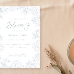 Pode incluir: Um cartão de convite branco com uma borda floral azul. O texto diz "Por favor, junte-se a nós na bênção do nosso filho Nixon James em 5 de junho de 2024 às 11h 121 Anywhere St, Any City RSVP: 123-456-7850 Almoço a seguir"