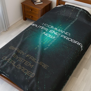 May include: Black and green throw blanket with a digital pattern and the text "I COMMAND, END PROGRAM, NOW!" and "BINARY FAILURE SYSTEM OVERLOADED".
