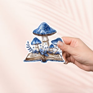 Blauwe paddenstoelen op open boek sticker, schattige leesgrage vinylsticker, leesgrage merchandise, boekenliefhebber cadeau, e-reader Kindle stickers, leesliefhebber