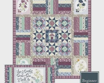 May include: A quilt and bench pillow pattern titled Coastal Beach Walk, featuring a 61" x 66" quilt and 36" x 16" pillow. The design includes floral motifs, star blocks, and a rectangular panel with the text Live in Sunshine, Swim the Sea, Drink the Wild Air.