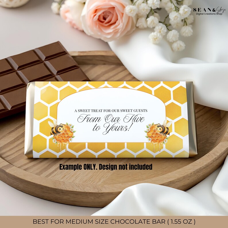 May include: A chocolate bar wrapper with a yellow honeycomb pattern and the text "A Sweet Treat for Our Sweet Guests From Our Hive to Yours!" The wrapper features illustrations of bees and honeycombs. The text "Example ONLY. Design not included" is also present.