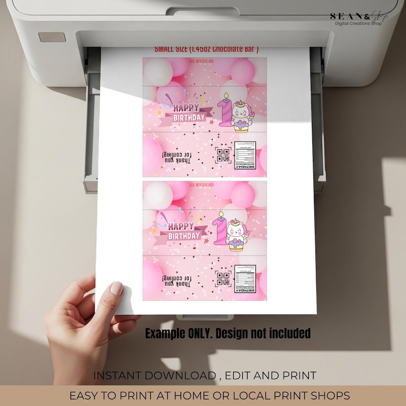 May include: Printed pink and white birthday-themed chocolate bar wrappers. The design includes the text "HAPPY BIRTHDAY", a number one candle, and a cartoon unicorn. The wrappers are printed on a white printer.