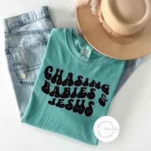 Chasing Babies And Jesus Graphic Tshirt