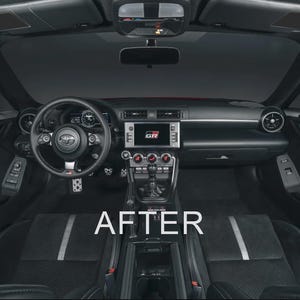 May include: Interior view of a car's dashboard and front seats. The dashboard is black with a central display screen and various controls. The steering wheel has a Toyota logo. The seats are black with a gray stripe. The word "AFTER" is displayed in white.