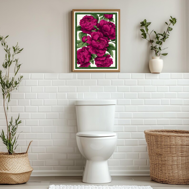 May include: A framed print of a floral arrangement featuring a cluster of vibrant pink peonies with green leaves against a white background.