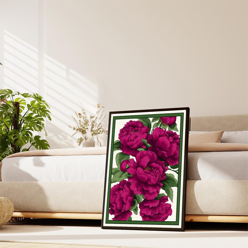 May include: A framed print of a bouquet of vibrant magenta peonies with green leaves against a white background.