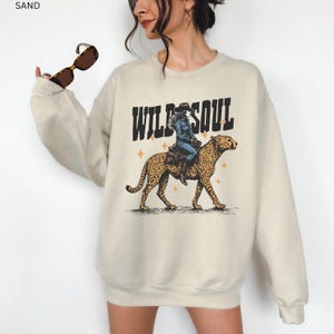 Wild Soul Crewneck Leopard Print Sweatshirt Western Cowgirl Design Retro Style Collection Vintage Inspired Fashion Country Rodeo Essential Ranch Clothing Comfortable Cotton Polyester Blend Unisex Adult Sizing Casual Western Outfit Fall