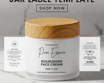May include: A white jar with a wooden lid labeled "Pure Essence Nourishing Face Cream." The label includes the text "50ML 1.7OZ" and "Plant-Based | Never Tested on Animals." Additional text includes "Jar Label Template" and "Shop Now."