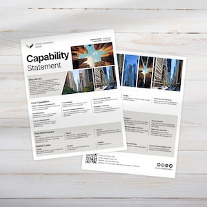 May include: Two white Capability Statement flyers with text and images of cityscapes. The flyers include sections on core capabilities, past performance, and contact information. The top flyer has the company name.