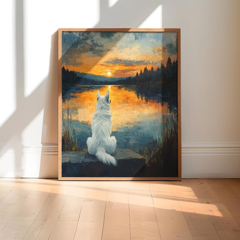 May include: A white dog sits on a rock overlooking a lake at sunset. The sky is a vibrant orange and yellow, and the water reflects the colors of the sky. The dog is looking out at the lake, and the trees in the background are silhouetted against the sunset.