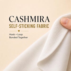 May include: A white self-sticking fabric labeled CASHMIRA SELF-STICKING FABRIC with the text Hook + Loop Bonded Together. The material has a soft, textured surface and is shown being pulled apart to reveal the hook and loop fastening mechanism.