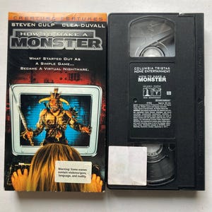 May include: A VHS tape and its cover for the movie "How to Make a Monster." The cover features a monster wielding a sword on a computer screen. The text on the cover includes the names Steven Culp and Clea Duvall.