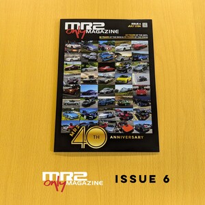 May include: A black and gold magazine cover with the title "MR2 Only Magazine" and the text "Issue 6 July 2024". The cover features a collage of photos of various red, yellow, blue, and white sports cars. The magazine celebrates the 40th anniversary of the MR2.