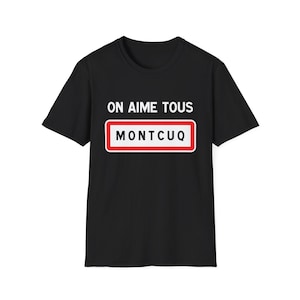 May include: Black t-shirt with the text "ON AIME TOUS" above a sign that reads "MONTCUQ" in white letters with a red border. The shirt is a short-sleeved crew neck.