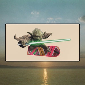May include: A green, cartoon-like character, resembling Yoda, rides a pink hoverboard with the word "Hoverboard" printed on it. The character holds a green lightsaber in their hand.