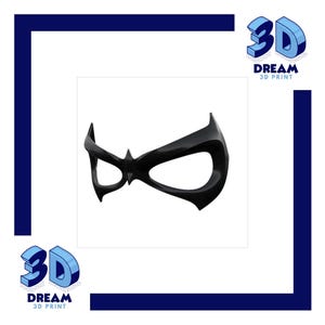 Può includere: Una maschera nera lucida con un design distintivo e stilizzato. La maschera presenta un punto centrale e aperture oculari curve. L'immagine include il testo "3D DREAM 3D PRINT" in un font 3D.
