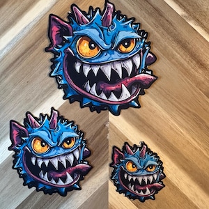 Blue Monster Sticker | Spiky Creature Vinyl Decal | Sharp Teeth Monster Art | Amber Eyes Character | Gaming Monster Collection
