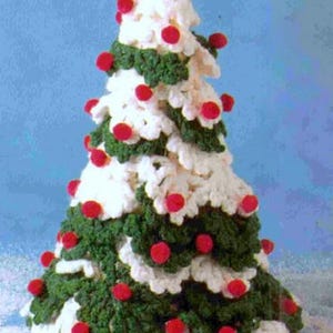 May include: A crocheted Christmas tree made with white yarn and green leaves, decorated with red pom-poms.