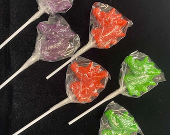 Piruletas de canela con cabeza de dragón, dulces con temática de D&D y fantasía.