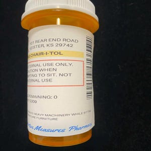 May include: An orange prescription bottle with a white cap. The label reads "CHAIR-I-TOL" and includes warnings about internal use and operating machinery. The pharmacy name "Time Measures Pharmacy" is visible.