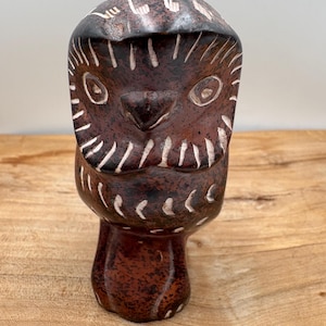 May include: A set of three ceramic mugs with a speckled, matte finish. The mugs are in shades of cream, light gray, and dark gray. Each mug has a simple, minimalist design, perfect for coffee or tea.