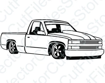 May include: A black and white line drawing of a pickup truck. The truck has a long bed and a large grille with horizontal bars. The truck is facing forward and has large wheels.