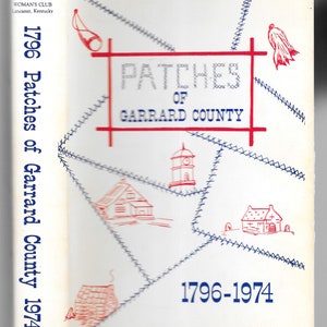 May include: A white book cover with blue and red stitching. The title is "Patches of Garrard County" with the years 1796 and 1974 on either side. The book cover features a red and white illustration of a church.
