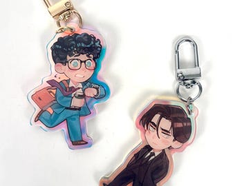 Tęczowe akrylowe breloki Clark Kent i Bruce Wayne