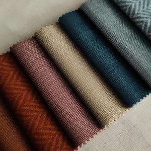 Luxurious velvet upholstery fabric available in 25 colors. High-quality, durable, and perfect for elegant furniture. Sold by the yard.