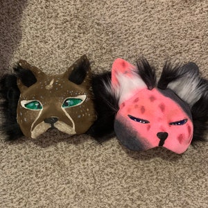 Two premade cardboard cat/feline masks