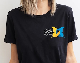 May include: A black t-shirt with a blue and yellow butterfly design and the text "World Down Syndrome Day".