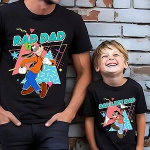 May include: A black t-shirt with a graphic of Goofy wearing sunglasses and the text "Rad Dad". A smaller black t-shirt with a graphic of Goofy wearing sunglasses and the text "Rad Like Dad".