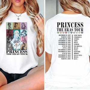 May include: White t-shirt with a graphic of Disney princesses on the front and a list of princesses and their movie release dates on the back. The text on the shirt reads "Princess The Eras Tour".