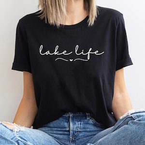 May include: Black t-shirt with white text that says "lake life" with a small heart symbol.