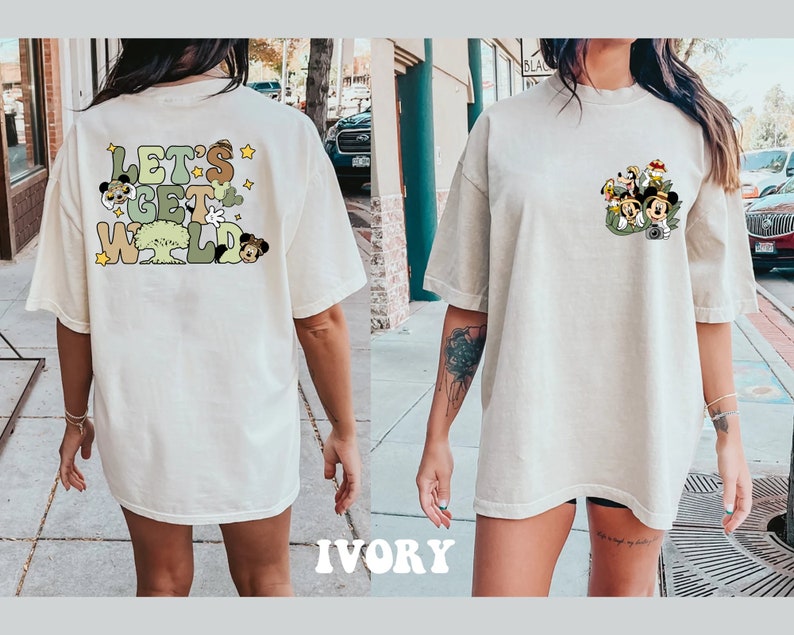 May include: A white oversized t-shirt with a graphic print of cartoon characters and the text "Let's Get Wild".