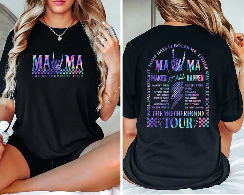May include: Black t-shirt with a rainbow graphic that says "Mama" and "The Motherhood Tour". The back of the shirt has a list of activities that "Mama" makes happen.