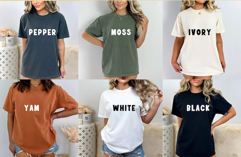 Puede incluir: Seis camisetas de diferentes colores con las palabras "Pepper", "Moss", "Ivory", "Yam", "White" y "Black" impresas en blanco.