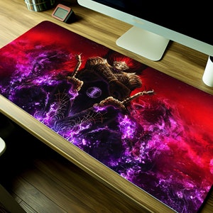 May include: A red and purple gaming mouse pad with a graphic of a creature with glowing eyes and horns. The creature is surrounded by swirling purple and red smoke.