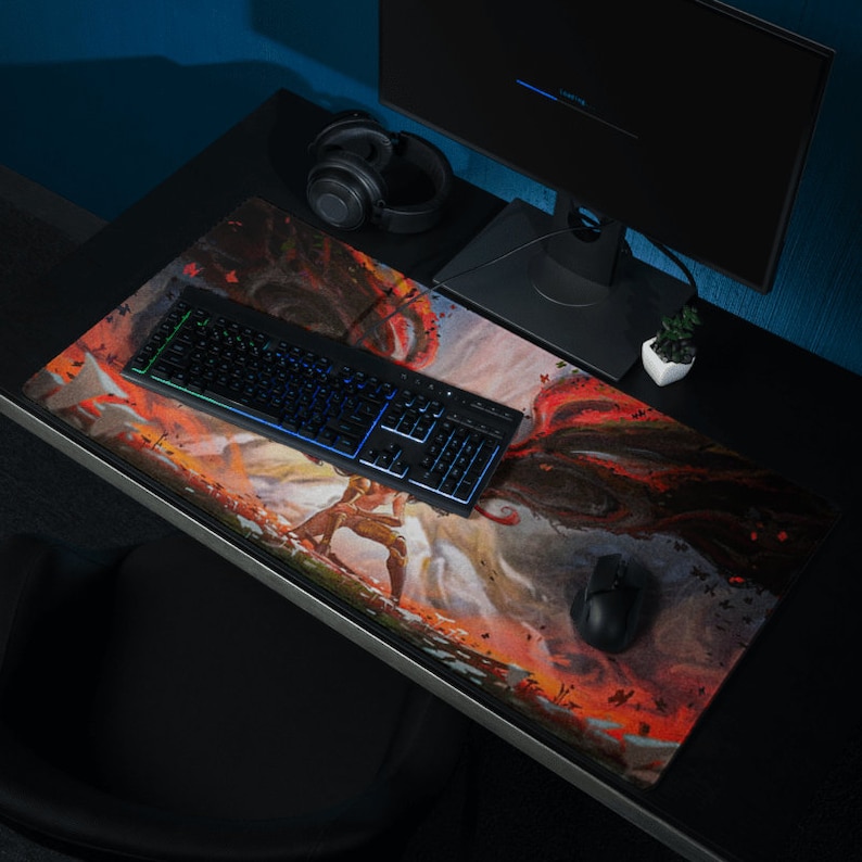 May include: A black and red gaming mouse pad with a colorful illustration of a warrior and a dragon. The mouse pad is on a black desk with a keyboard, a headset, and a computer monitor.