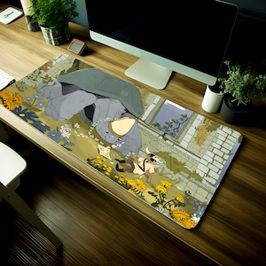 May include: A rectangular mouse mat with a fantasy illustration. A large, grey turtle-like figure is the focal point, wearing a floral crown. A small character lies amongst flowers. The background features a brick wall and a window.